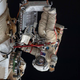 Roscosmos cosmonaut Oleg Artemyev waves to the camera during a spacewalk in April 2022.